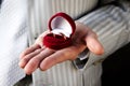 Wedding rings in red casket on the hand Royalty Free Stock Photo