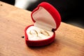 Wedding rings in a red heart shaped box Royalty Free Stock Photo