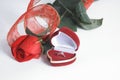 Wedding rings and red rose on white background.photo with copy space Royalty Free Stock Photo