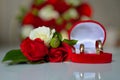 Wedding rings, red roses Royalty Free Stock Photo