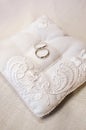 Wedding rings on ring barer pillow Royalty Free Stock Photo