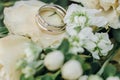 Wedding rings with rose flowers, selective focus Royalty Free Stock Photo