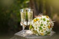 Wedding rings with roses and glasses of champagne Royalty Free Stock Photo