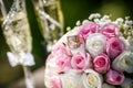 Wedding rings with roses and glasses of champagne Royalty Free Stock Photo