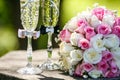 Wedding rings with roses and glasses of champagne Royalty Free Stock Photo