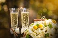 Wedding rings with roses and glasses of champagne Royalty Free Stock Photo