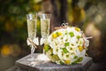 Wedding rings with roses and glasses of champagne Royalty Free Stock Photo