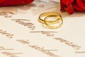 Wedding Rings with roses and vows Royalty Free Stock Photo