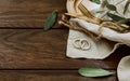 Wedding rings on rustic background Royalty Free Stock Photo
