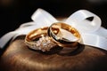 Wedding rings in silver and gold, set against a shimmering bokeh backdrop Royalty Free Stock Photo