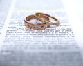 Wedding rings and Spanish Bible scripture Royalty Free Stock Photo