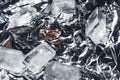 Wedding rings with splashes of water and pieces of ice. Wedding concept Royalty Free Stock Photo