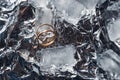Wedding rings with splashes of water and pieces of ice. Wedding concept Royalty Free Stock Photo