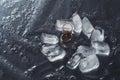 Wedding rings with splashes of water and pieces of ice. Wedding concept Royalty Free Stock Photo