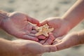 Wedding rings on a starfish in hands of the groom and bride Royalty Free Stock Photo