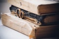 Wedding rings on top of books Royalty Free Stock Photo