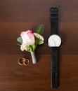 Wedding rings, watch, boutonniere