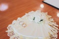 Wedding rings on a white satin pillow. Royalty Free Stock Photo