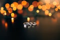 Wedding rings on a yellow background bokeh of garlands. Magical Royalty Free Stock Photo