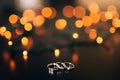 Wedding rings on a yellow background bokeh of garlands. Magical Royalty Free Stock Photo