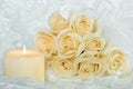 rose bouquet and candle on lace