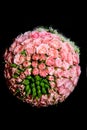 Wedding round bridal bouquet of pink roses on a black background