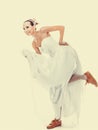 Wedding. Running bride funny woman in sport shoes Royalty Free Stock Photo