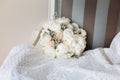 Wedding rustic bouquet on vintage striped chair. Bridal room interior.