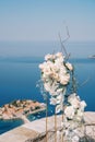 Wedding semi-arch stands on the observation deck above the island of Sveti Stefan. Montenegro