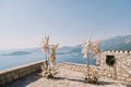 Wedding semi-arch stands on the observation deck above the sea