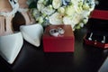 Wedding set of the bride. Shoes and rings lie next to the wedding bouquet Royalty Free Stock Photo