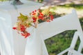 Wedding set up. Ceremony in the bosom of nature. White chairs with flowers set in the grass Royalty Free Stock Photo