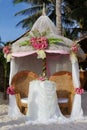 Wedding setup and flowers on tropical beach background