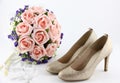 Wedding shoes and a bouquet of flowers Royalty Free Stock Photo