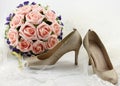 Wedding shoes and a bouquet of flowers