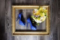 Wedding shoes and bouquet in gold frame. wedding Royalty Free Stock Photo