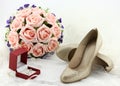 Wedding shoes and a bride veil and a wedding ring Royalty Free Stock Photo