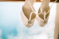 Wedding shoes of the bride at a window. Royalty Free Stock Photo