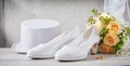 Wedding shoes next to flower bouquet and hat Royalty Free Stock Photo