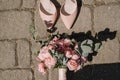 Wedding shoes and wedding paraphernalia, wedding gold rings, wedding bouquet Royalty Free Stock Photo