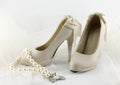 Wedding shoes and a string of pearls Royalty Free Stock Photo