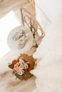 Wedding shoes and wedding bouquet on the chair Royalty Free Stock Photo