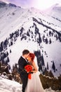 Wedding snowboarders couple just married at mountain winter