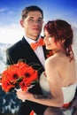 Wedding snowboarders couple just married at mountain winter