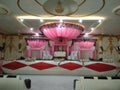 Wedding stage, beautiful interior design, flowers for decoration and pink dominates in colours of decoration