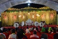 Wedding stage for jai mala prograamme with green carpet red chair and white coulor roof silver front, Royalty Free Stock Photo