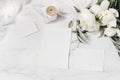 Wedding stationery, still life composition. Greeting cards mockup scene. Bouquet of white peony flowers, olive branches