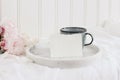 Wedding still life scene. Business, place card mockup scene, marble tray, cup of coffee an pink peony flowers on white