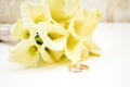 love, family, celebration, ceremony concept -wedding symbols two golden rings with callas white flowers Royalty Free Stock Photo