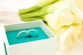 love, family, celebration, ceremony concept -wedding symbols two golden rings with callas white flowers Royalty Free Stock Photo